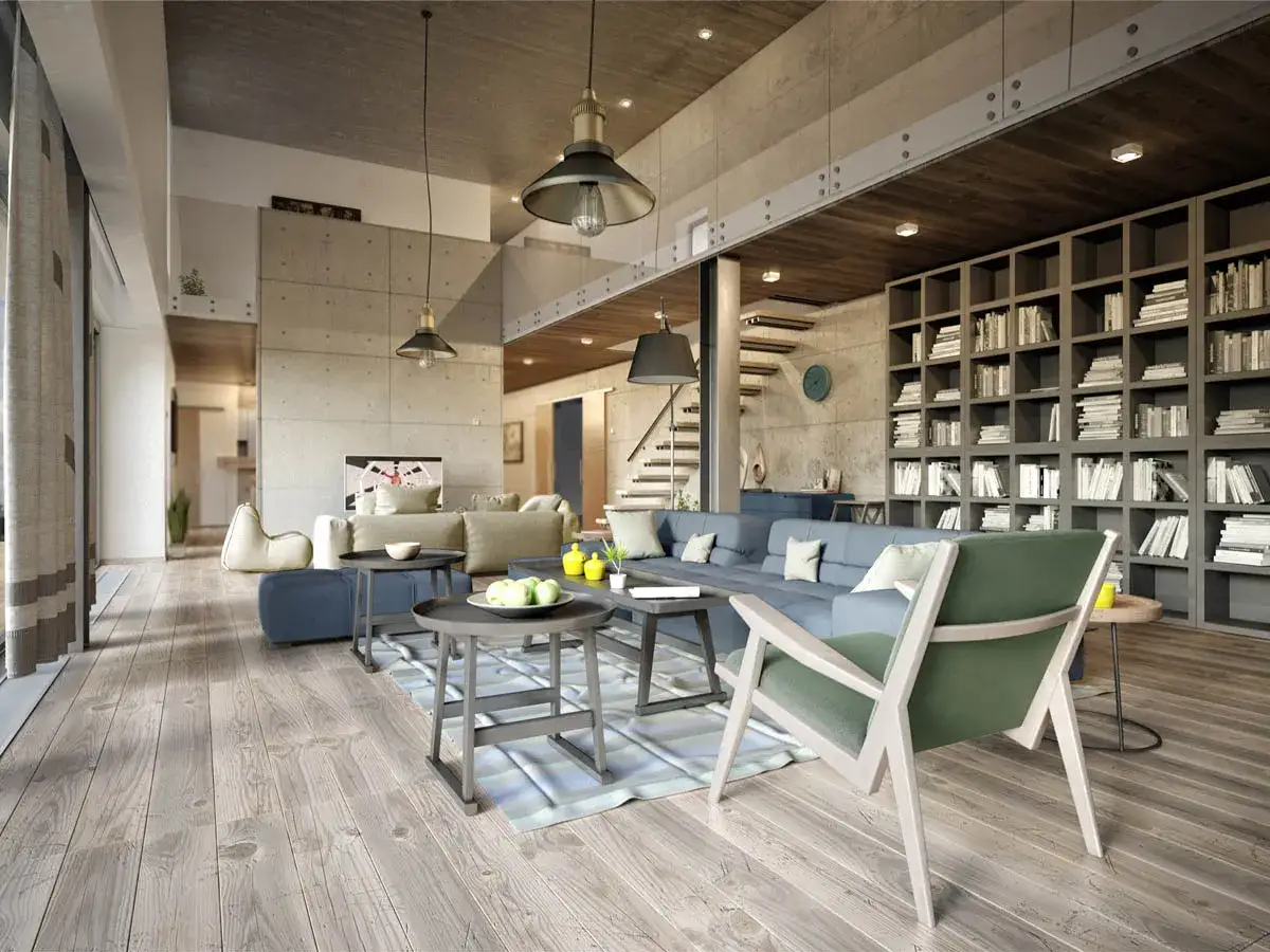 Geräumige, helle industrial wohnung mit Betonwänden, Holzboden, großer Couch und Bücherregalwand.